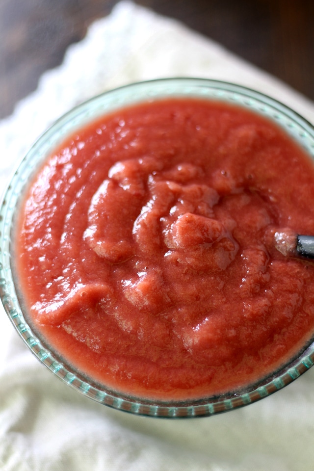 Naturally sweet healthy homemade slow cooker applesauce made pretty pink with the addition of plums.
