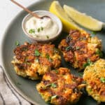 Salmon Croquettes served with tarter sauce and lemon wedges.