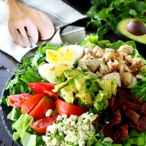 This Healthy Chicken Cobb Salad has all of the goodness you remember from the classic cobb salad, but the flavor is kicked up in a major way!