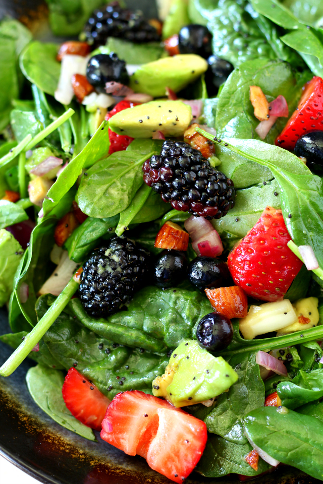 Get ready to shake up your summer cookout with this sweet, colorful and oh-so-sassy easy-to-make bright triple berry almond spinach salad! (vegan, dairy and gluten free)