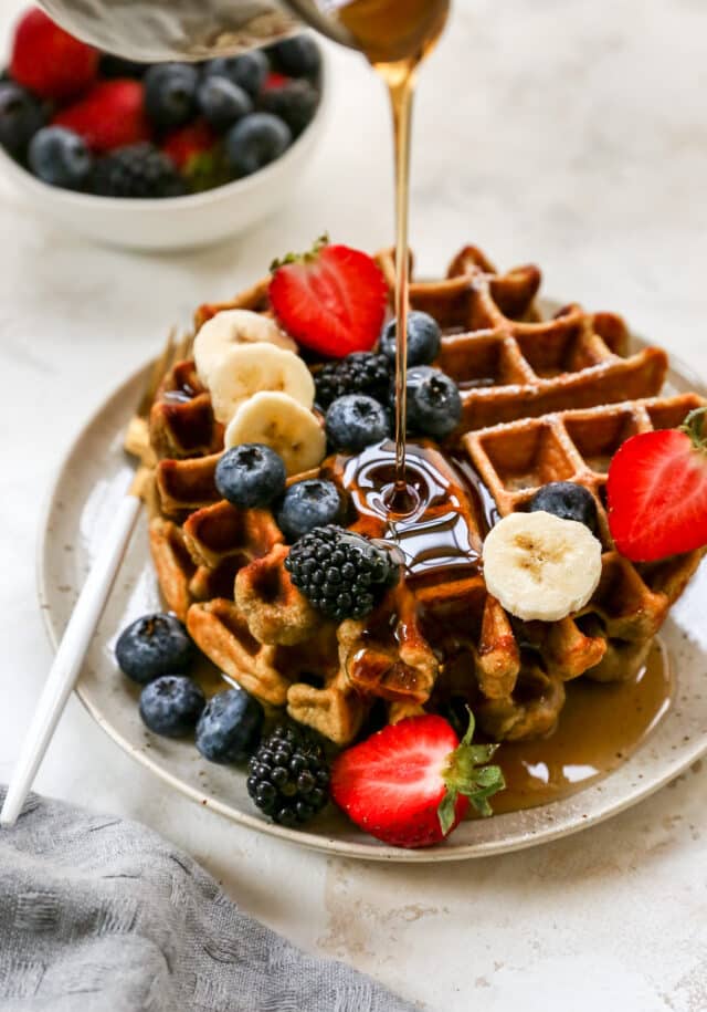 drizzling syrup on protein waffle