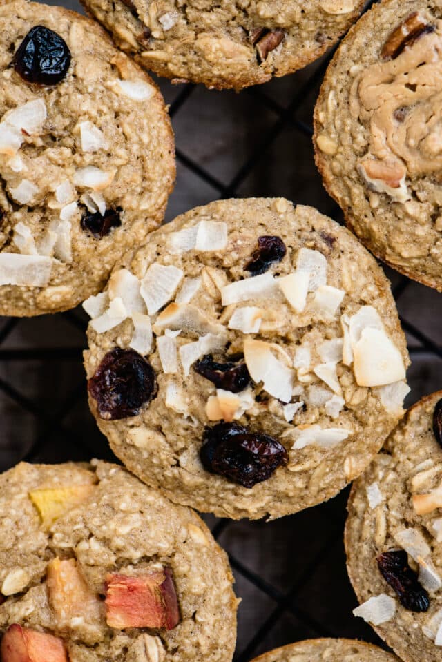 baked oatmeal cups topped with shredded coconut and dried cranberries