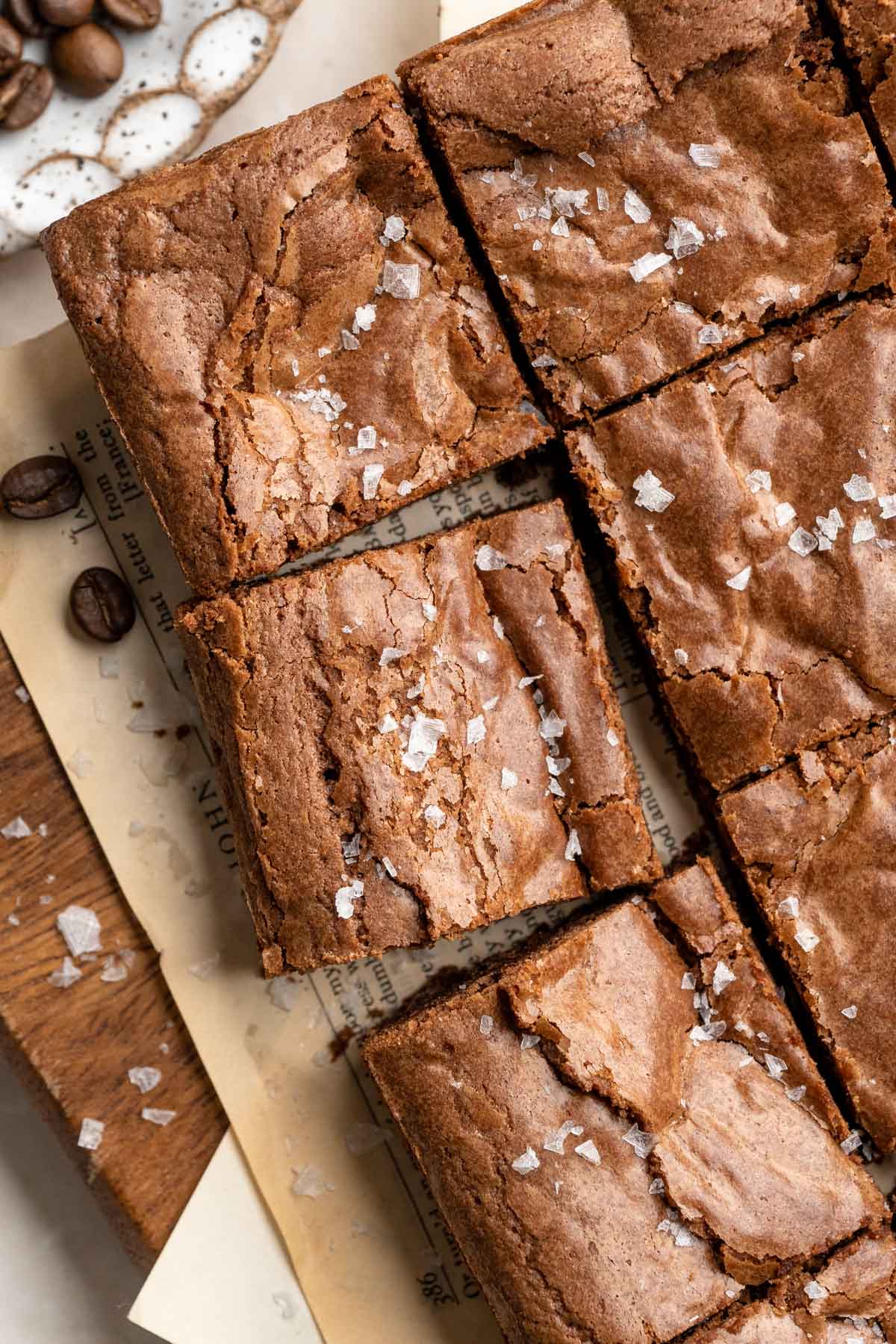 Brownies cut into squares and topped with flaky sea salt.