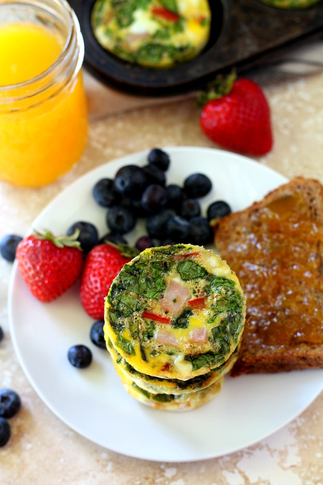 Spinach Ham Egg Muffins with lean ham, spinach and bell pepper are so flavorful, uber healthy, gluten free, dairy free and paleo. They're the perfect on-the-go breakfast and even kid-friendly!