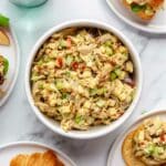 Curried chicken salad served with croissants and crackers.