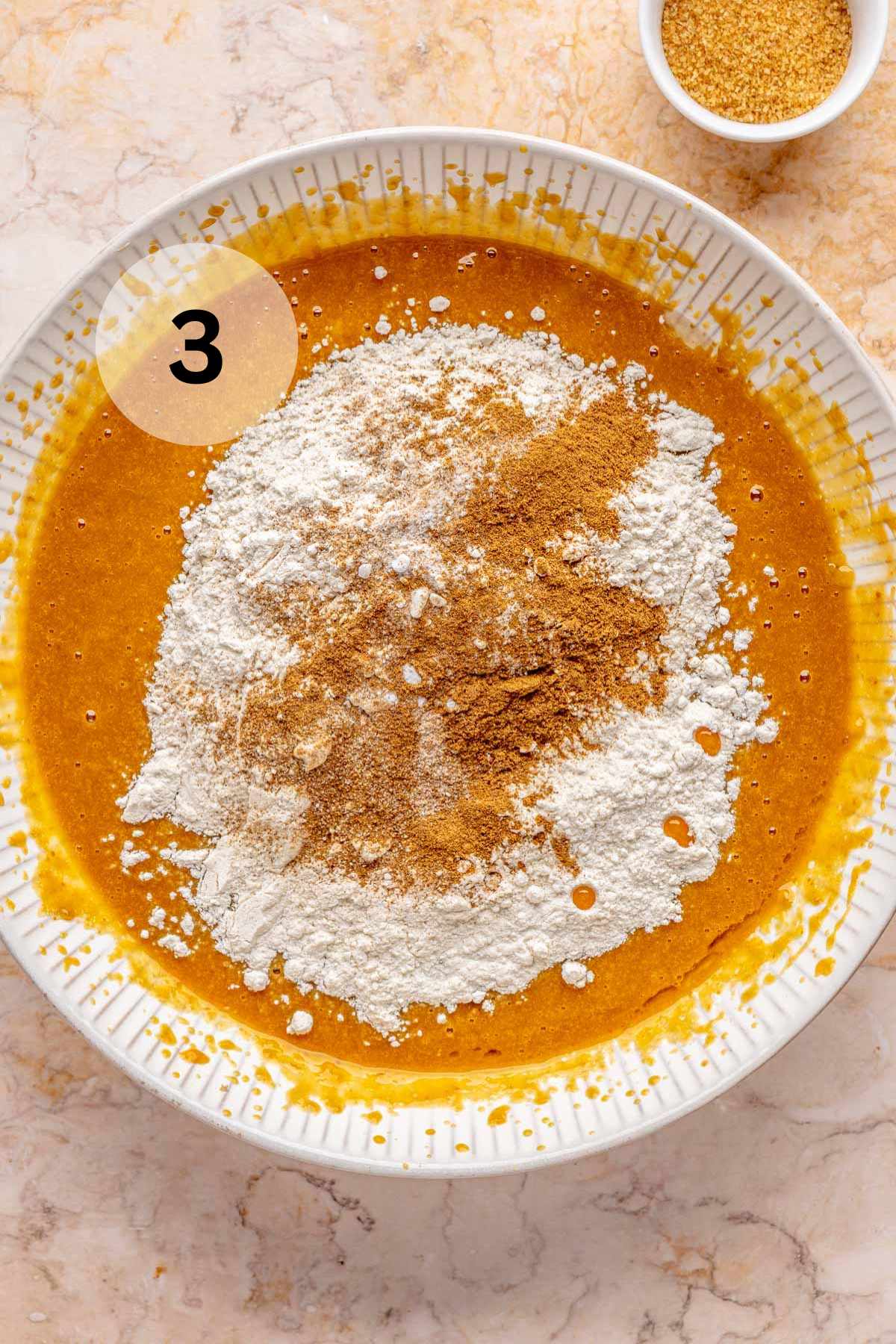 Mixing batter for pumpkin muffins.