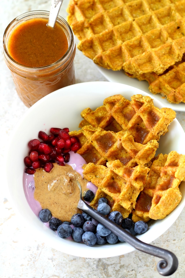 Gluten-Free Pumpkin Oat Waffles - loaded with delightful fall flavor without any of the guilt. Whip them up in the blender to get your morning started easily and deliciously!