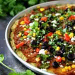Lots of yummy flavor in this Gluten-Free Taco Pizza! All of your favorite taco ingredients combine atop a gluten-free pizza crust for an amazing dinner!