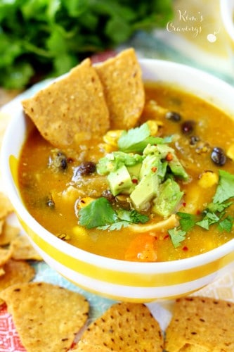Delight your tastebuds with hearty comforting Creamy Pumpkin Chicken Tortilla Soup! Made with pumpkin puree and Greek yogurt, so it's thick and velvety. This tortilla soup is also quite the flavor explosion- whipped up with guilt-free delicious ingredients.