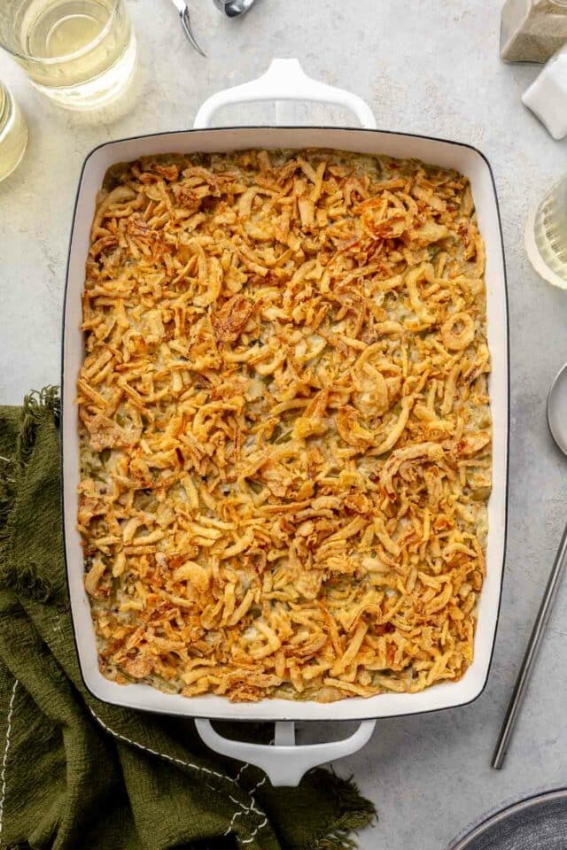 Baked green bean casserole topped with fried onions.