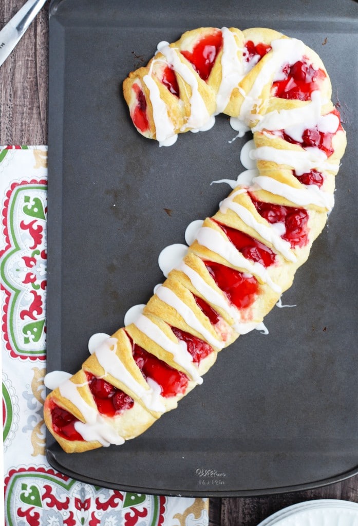 Candy Cane Crescent Roll Breakfast Pastry with a cream cheese and cherry filling- sure to impress with minimal effort for a breezy Christmas treat.