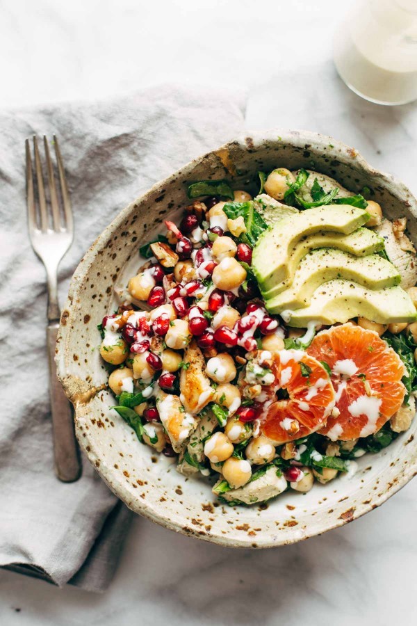 chickpea chicken salad in a small bowl with fork 