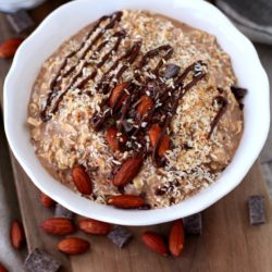 Overnight Oatmeal topped with almonds and chocolate drizzle
