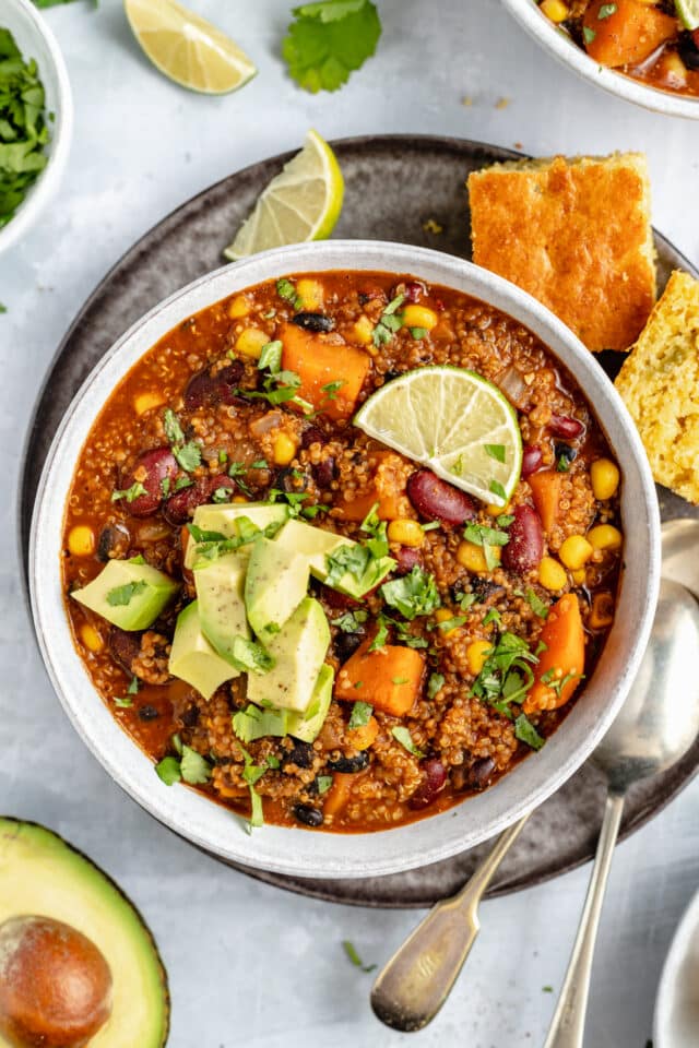 vegetarian chili topped with lime, avocado, and fresh cilantro