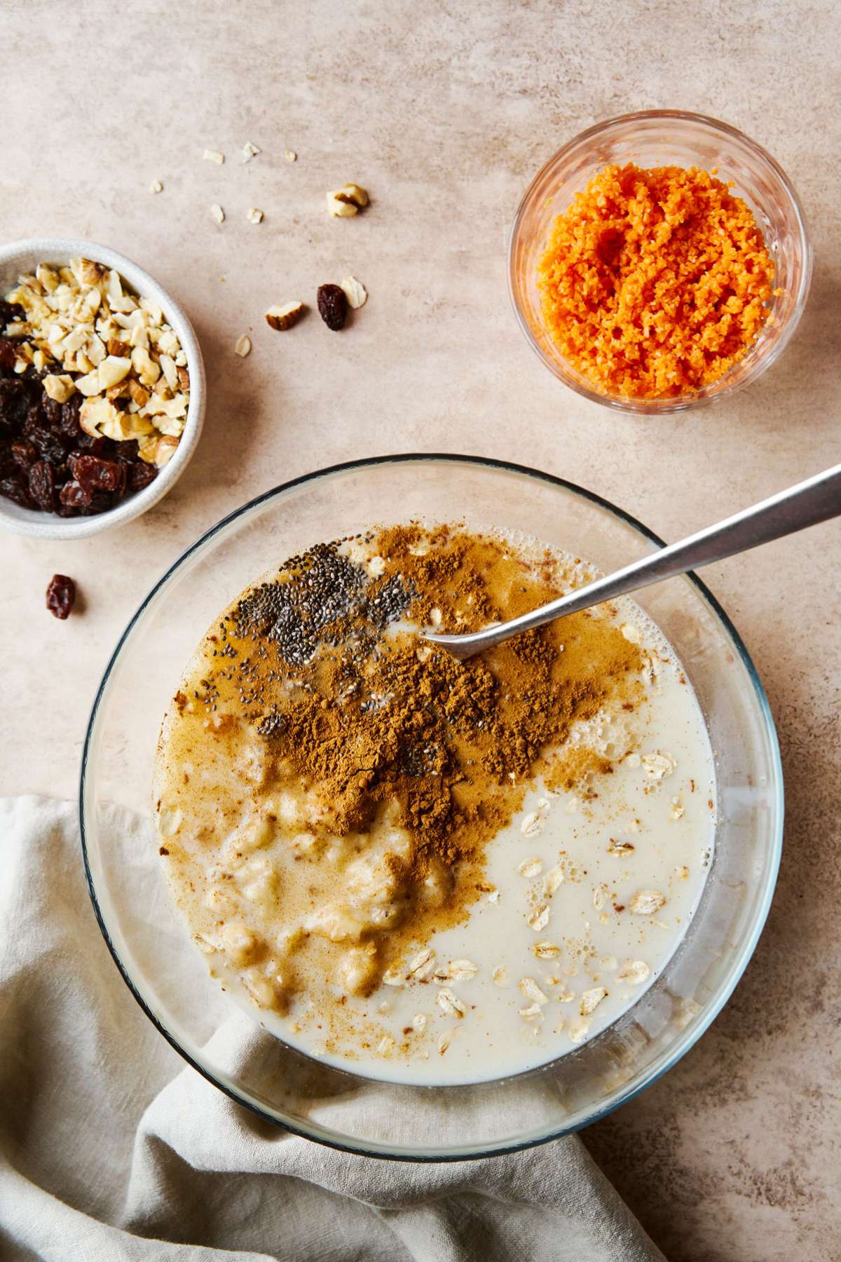 Combining milk with mashed banana, chia seeds and spices in a large bowl.