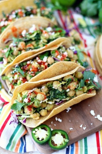 Insanely delicious Chickpea Avocado Tacos. Hearty, healthy, and ready in less than 20 minutes with no heat required. The perfect plant-based, gluten-free lunch or dinner!