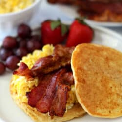 Rise and shine, lovelies, we're cooking up the ultimate of breakfast sandwiches! You guys are going to go crazy for these Bacon Egg Pancake Breakfast Sandwiches!