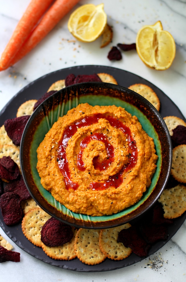 The perfect marriage of sweet and spicy - this Zesty Carrot Ginger Hummus is the perfect appetizer to ring in spring time snackin'!