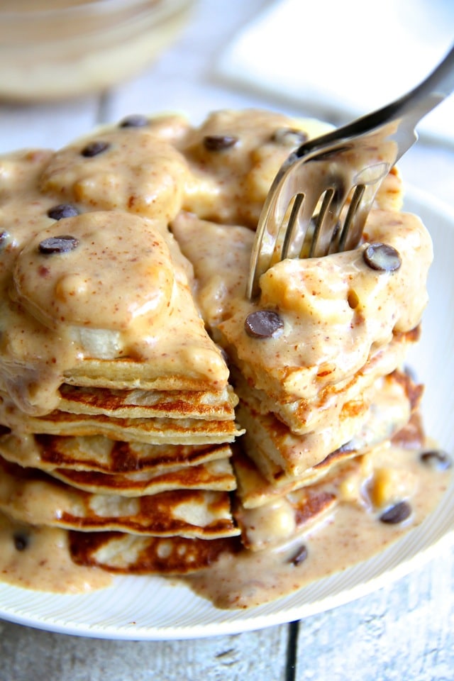 Light, fluffy, and loaded with bananas, chocolate, and nuts, these Chunky Monkey Greek Yogurt Pancakes make an easy and delicious breakfast! Gluten-free thanks to the oats, they’ll keep you satisfied all morning with over 20g of protein!