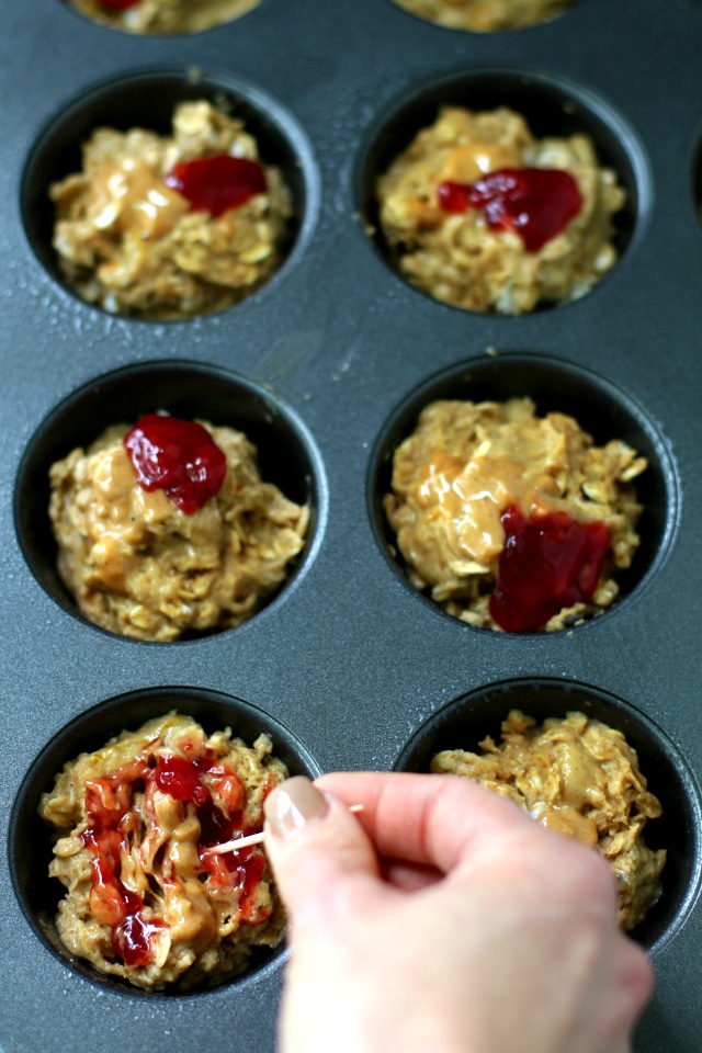 Topped with fruit spread and peanut butter swirls, these Gluten-Free Peanut Butter and Jelly Muffins are so soft, tender and scrumptious!