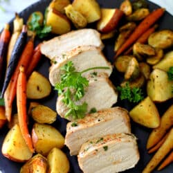Sheet Pan Pork Meal with red potatoes, carrots and Brussels sprouts - an easy, healthy, one-pan meal perfect for busy weeknights!