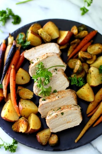 Sheet Pan Pork Meal with red potatoes, carrots and Brussels sprouts - an easy, healthy, one-pan meal perfect for busy weeknights!