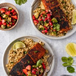 Blackened salmon served with strawberry salsa over rice.