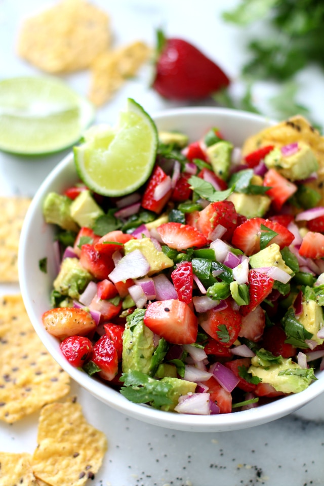 strawberry salsa with chopped strawberries, avocado, jalapeño and cilantro in a small white bowl