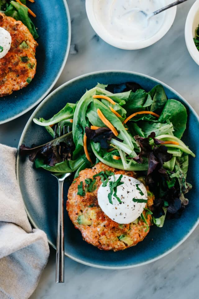 salmon burger served with a salad and homemade ranch