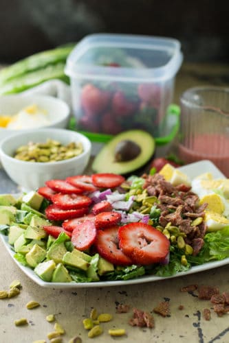 This delicious Whole30 Strawberry Cobb Salad is quick and easy to make, full of great fresh flavors, and tossed with a simple strawberry dressing.