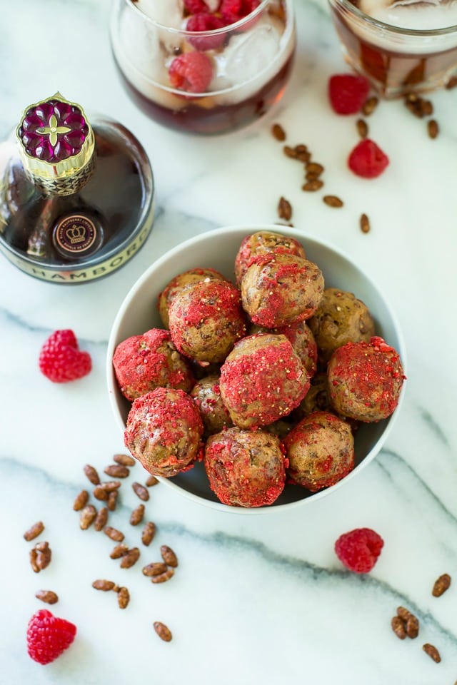 Easy, 6-ingredient no bake raspberry cookie bites with a perfect sweet-tart flavor and a delicious crispy crunch! Pair these with Chambord Spritzes for the ultimate girls' night treat!