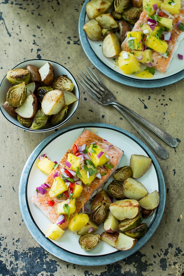 This one pan cajun salmon is super juicy with just kick of spice and gets topped off with a tangy hit of pineapple salsa. All made on one tray and ready in 30 minutes.