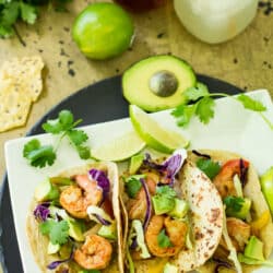 Grilled Shrimp Fajita Foil Packets are so easy and delicious. Perfectly cooked in foil - juicy shrimp, tender bell peppers and onions can be wrapped into a warm tortilla for a super fast dinner, that's packed with incredible flavor!