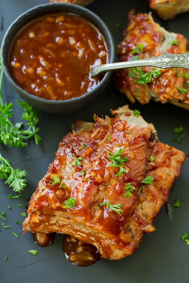 Grilled Sriracha Ribs are falling off the bone amazing, cooked on the grill and smothered in an irresistible saucy Sriracha sauce! Who knew you could enjoy amazing ribs, right at home?