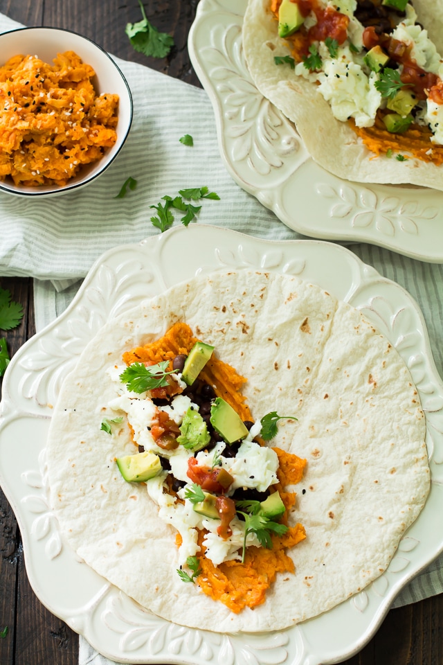 Healthy breakfast burritos stuffed with sweet potatoes, black beans, egg whites, and avocado. You’re going to love this easy protein-packed breakfast!