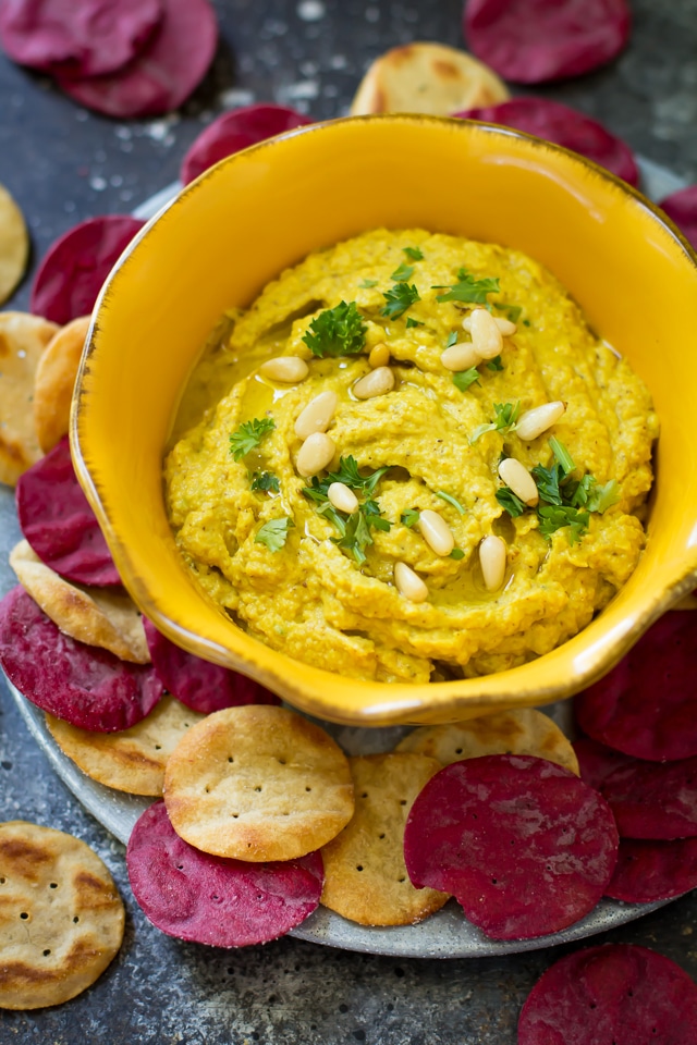 This golden turmeric cauliflower hummus is an easy, tasty paleo, vegan and gluten-free dip that’s made with wholesome ingredients. It works great as a snack or appetizer and it's ready in 10 minutes!