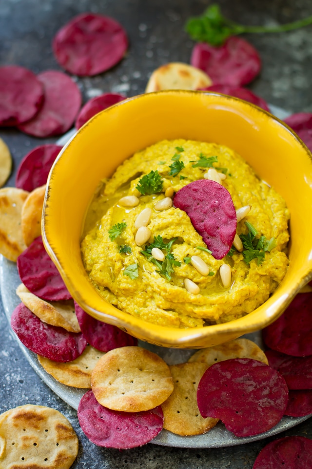 This golden turmeric cauliflower hummus is an easy, tasty paleo, vegan and gluten-free dip that’s made with wholesome ingredients. It works great as a snack or appetizer and it's ready in 10 minutes!