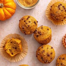 Pumpkin protein muffins topped with chocolate chips.