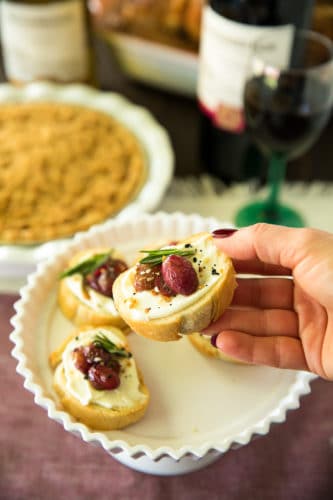 Roasted Grape Crostini is an easy, elegant appetizer that’s perfect for the holiday season. Oven-roasted balsamic-infused grapes, complement creamy ricotta and crusty bread so deliciously and it's especially lovely served with wine.