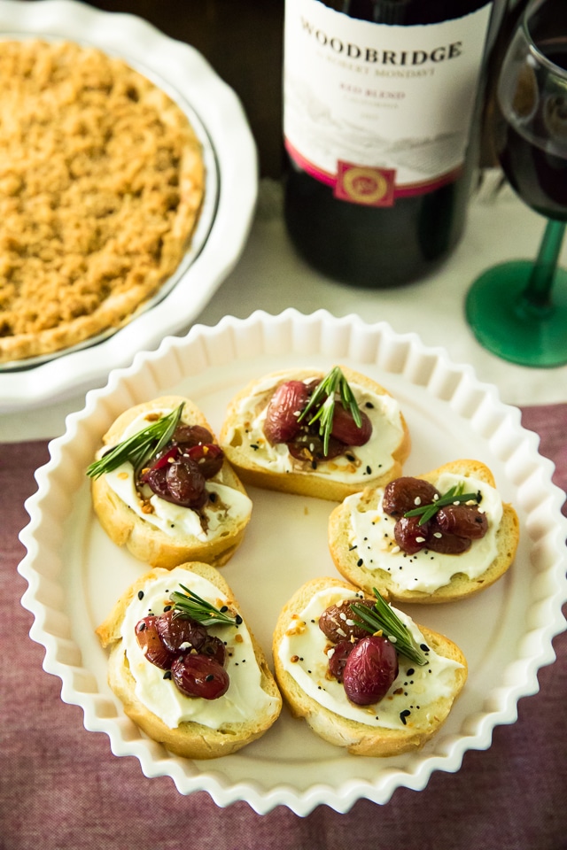 Roasted Grape Crostini is an easy, elegant appetizer that’s perfect for the holiday season. Oven-roasted balsamic-infused grapes, complement creamy ricotta and crusty bread so deliciously and it's especially lovely served with wine.