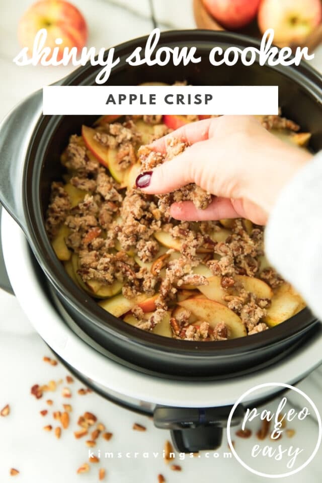woman's hand adding the crisp topping to an apple crisp