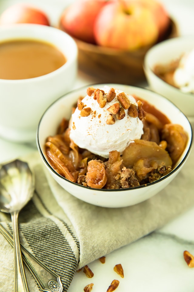 With a super crisp, nutty topping blanketing a warm and cozy, apple cinnamon-spiced filling, this Skinny Slow Cooker Apple Crisp is absolutely irresistible! Vegan, Paleo, Gluten-Free, Dairy-Free.