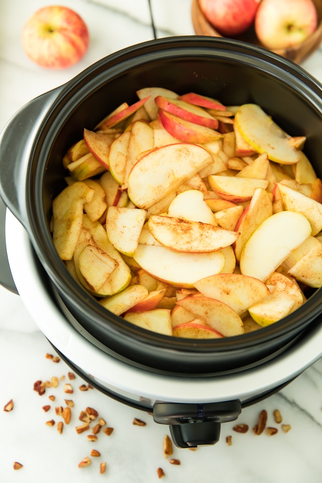 With a super crisp, nutty topping blanketing a warm and cozy, apple cinnamon-spiced filling, this Skinny Slow Cooker Apple Crisp is absolutely irresistible! Vegan, Paleo, Gluten-Free, Dairy-Free.