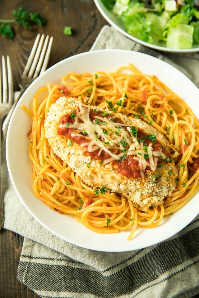 Quick and easy, this Gluten Free Chicken Parmesan is a classic Italian favorite made lighter in this recipe, by baking instead of frying. Don’t worry, though, it's still as tasty, crispy and family-friendly as the original!