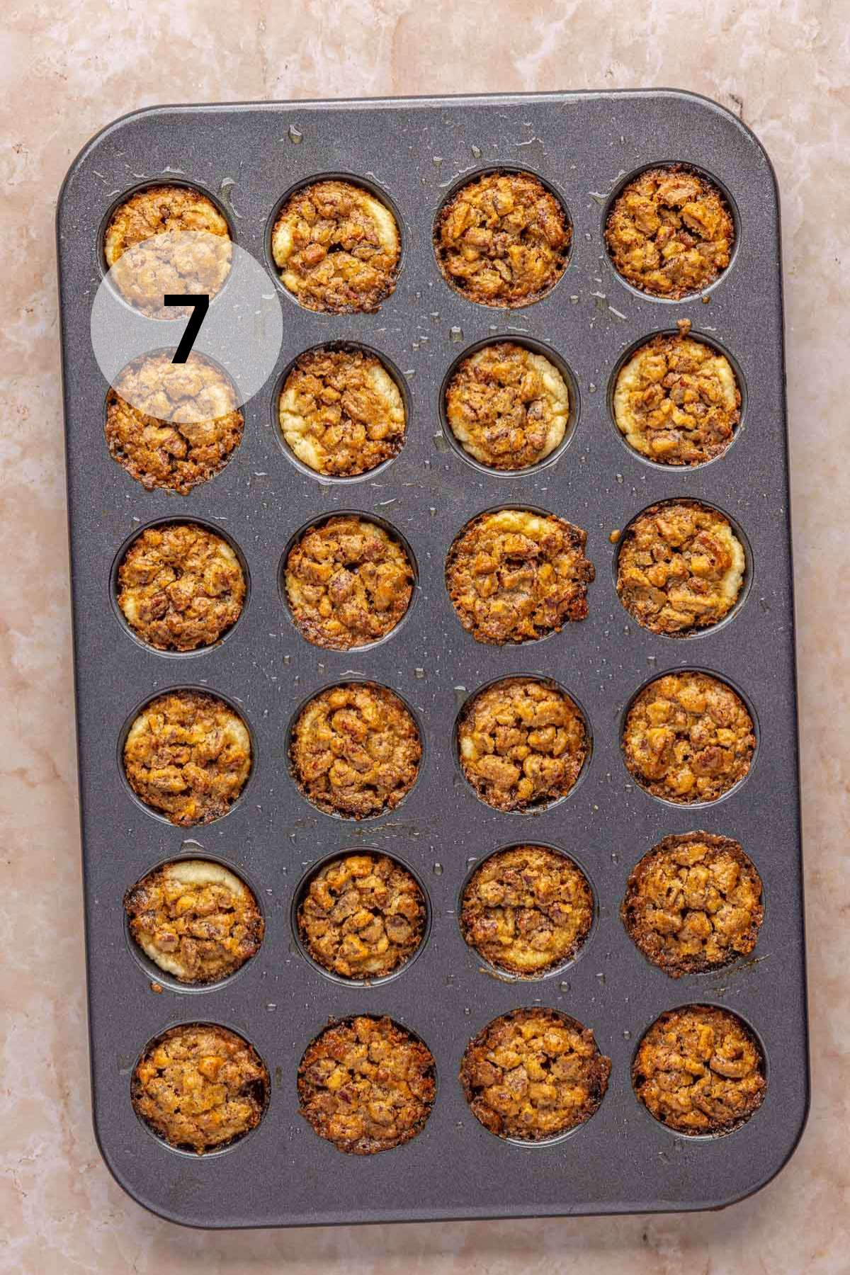 Baked pecan tartlets in a mini muffin pan.