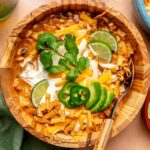 Chicken enchilada soup topped with sour cream, cilantro, jalapeños and lime.