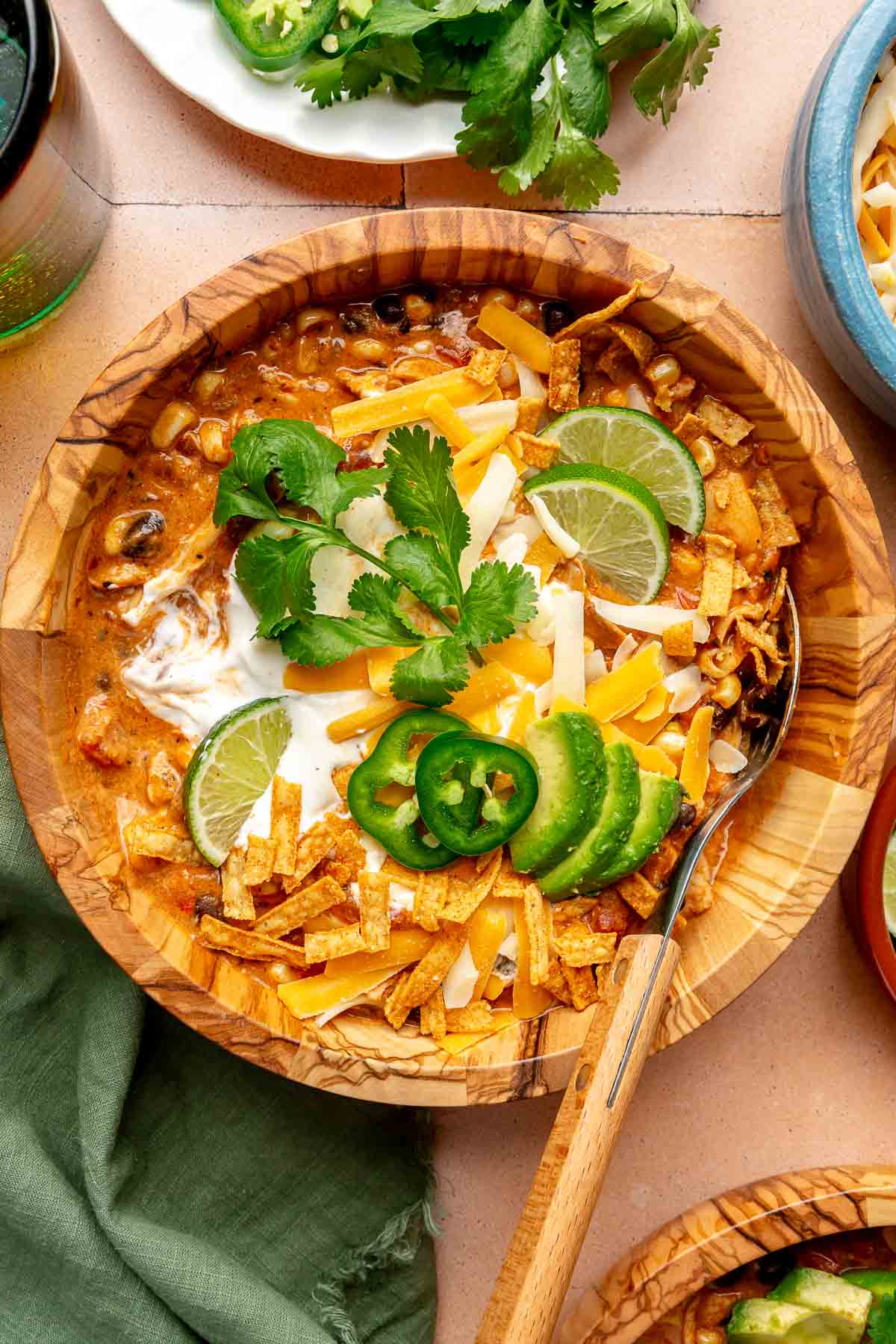 Chicken enchilada soup topped with sour cream, cilantro, jalapeños and lime.