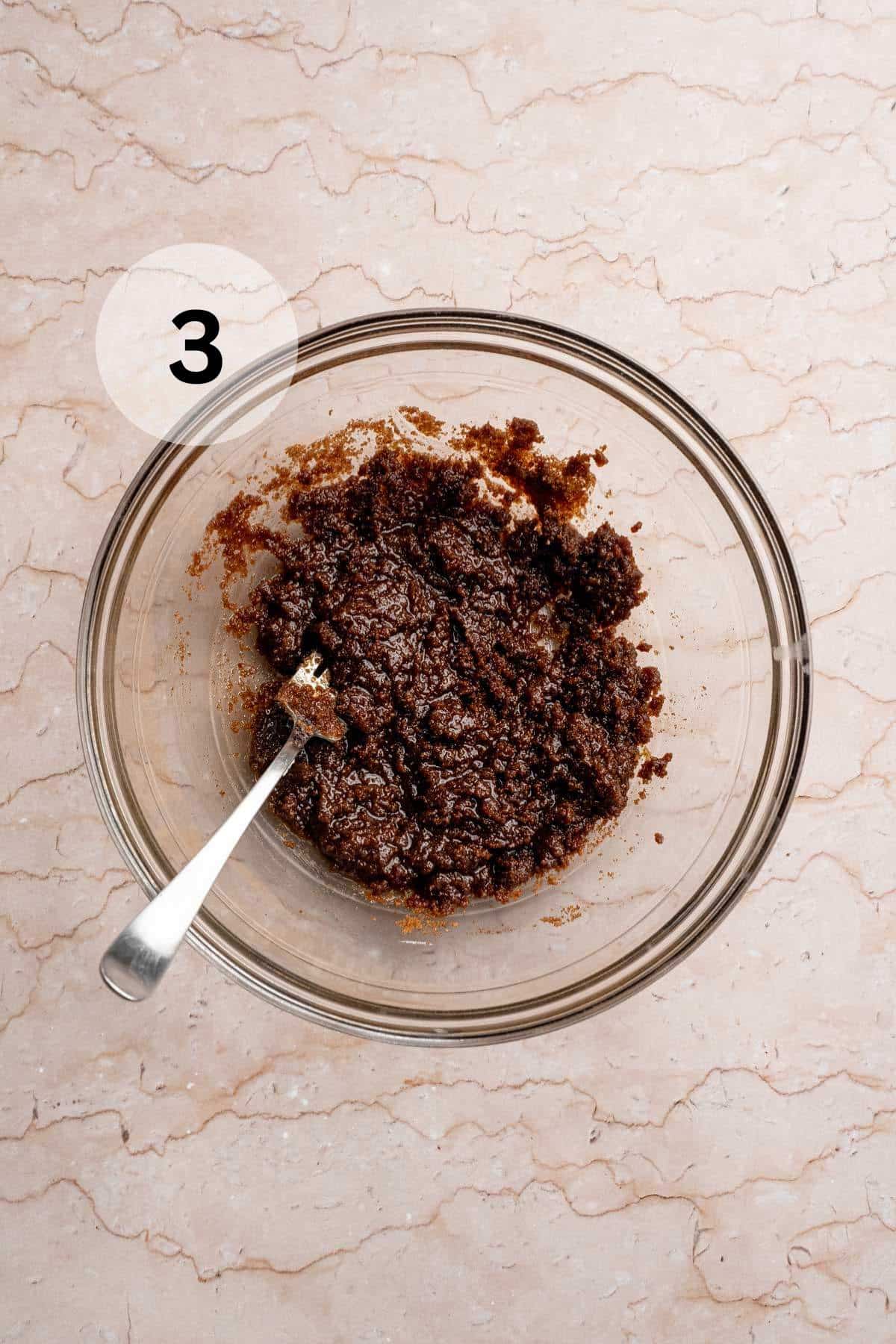 Stirring together cinnamon and brown sugar with butter in a small bowl.