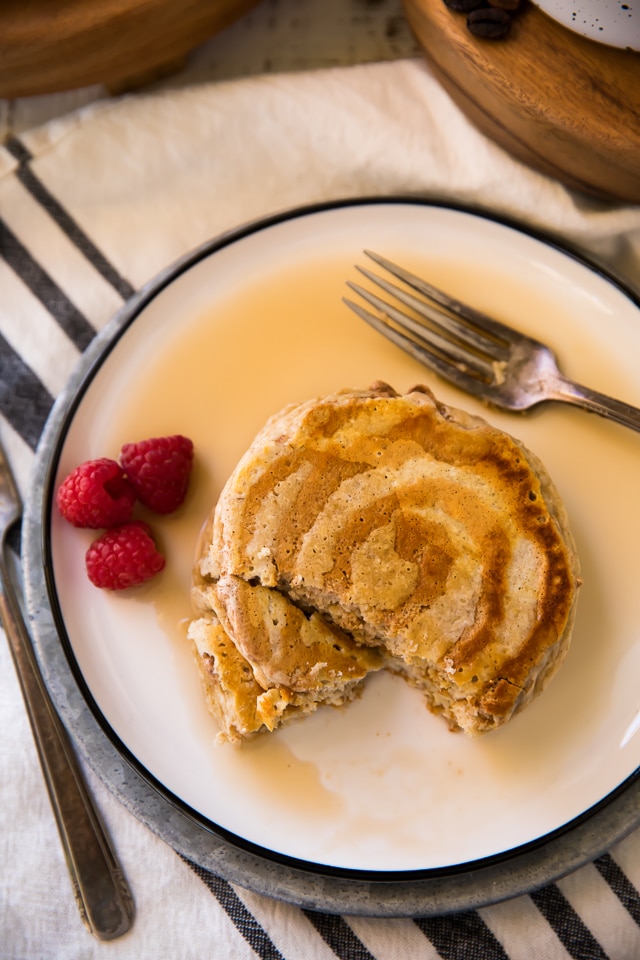 These Cinnamon Roll Protein Pancakes taste just like a decadent cinnamon roll but without all the guilt… a perfect holiday (or any day) breakfast treat!