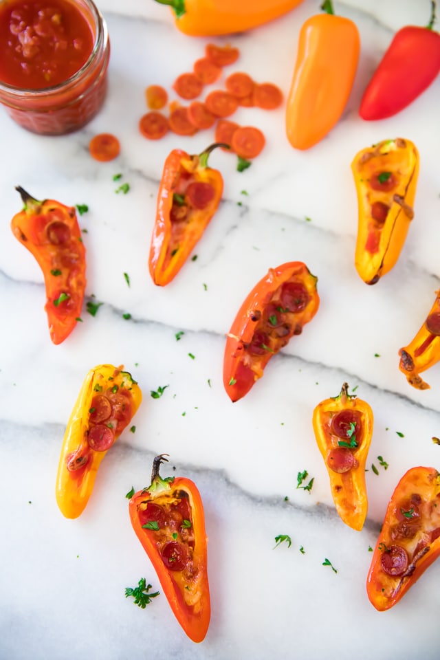 These hand-held Mini Pepper Pizzas embrace the deliciousness of pizza with a healthy twist! They make the perfect appetizer and a great snack too!